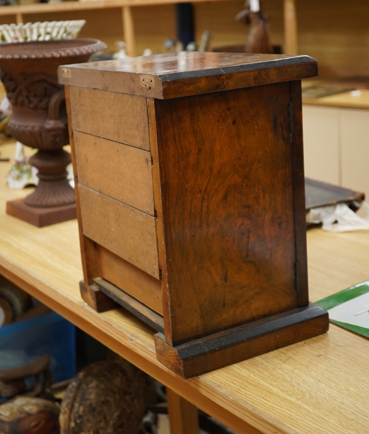 A Victorian walnut miniature two door tabletop cabinet/chest with two short and three long drawers inside. 32cm wide x 37cm high